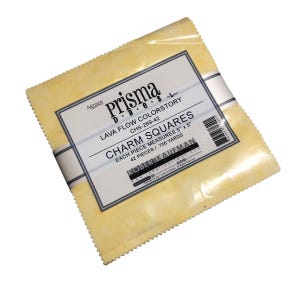 May include: A package of Prisma Dyes Lava Flow Colorstory charm squares. Each square measures 5" x 5". The package contains 42 pieces. The label includes the text "Robert Kaufman". The fabric squares are a light yellow color.