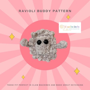 May include: A gray crocheted plush toy shaped like a ravioli with black eyes. The toy is on a pink background with a white circle and text that says "Lil Nellie Knits" and "Crocheting with love". The text below the toy says "These fit perfect in claw machines and make great keychains".