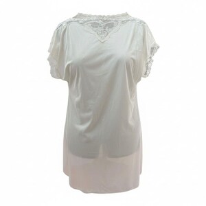 May include: A white, short-sleeved slip with lace detailing around the neckline and sleeves. The slip has a V-neck and a flowing, knee-length design. The fabric appears to be lightweight and semi-sheer, with a subtle sheen.