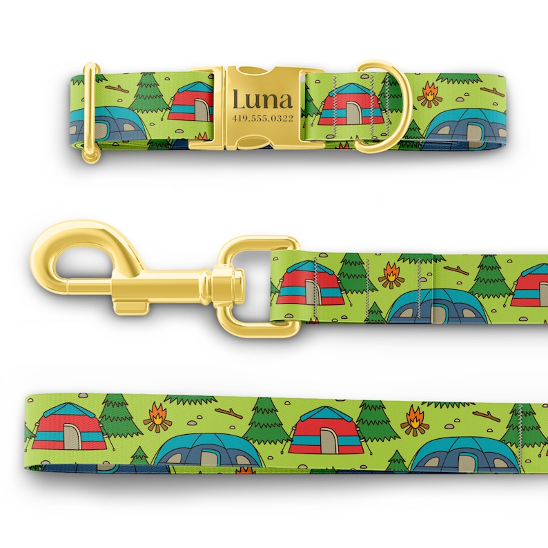 May include: A green dog collar and leash with a camping theme. The collar has a gold buckle with the name "Luna" and a phone number. The leash has a gold clip.