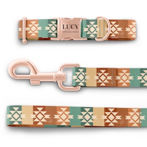 May include: A rose gold dog collar and leash set with a geometric pattern in shades of brown, beige, and teal. The collar has a personalized name tag that reads "LUCY" with a phone number.