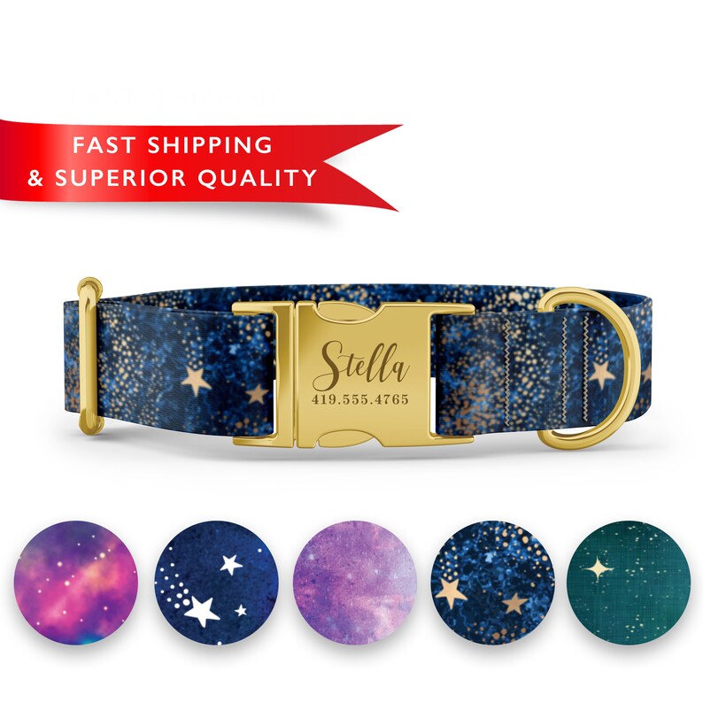 May include: A blue dog collar with gold glitter and stars, featuring a gold buckle with the name "Stella" and a phone number engraved on it. The collar is shown against a white background.