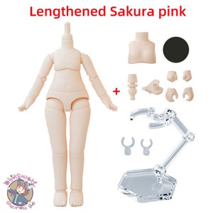 May include: A nude-colored plastic doll body with articulated limbs and a stand. The doll is posed with arms outstretched. The doll is part of a set that includes extra hands, a bust, and a stand.