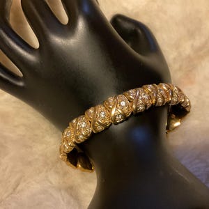 May include: A set of three ceramic mugs with a speckled, matte finish. The mugs are in shades of cream, light brown, and dark brown. Each mug has a simple, minimalist design, perfect for coffee or tea.