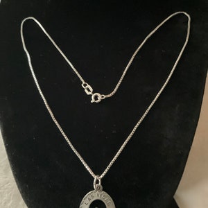 16”Sterling Silver necklace and Las Vegas pendant w/emerald stone