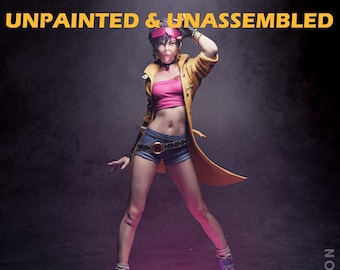 May include: Unpainted and unassembled plastic model kit of a female superhero figure with pink hair, wearing a yellow jacket, pink top, blue denim shorts, and pink boots. The figure is standing on a black base with a pink X-shaped design. The text "UNPAINTED & UNASSEMBLED" is at the top of the image, and "CA3D STUDIOS" is at the bottom.