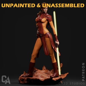 May include: Unpainted and unassembled 3D printed figurine of a female character with a lightsaber. The character is wearing a brown and orange outfit and is standing on a rocky base. The text "UNPAINTED & UNASSEMBLED" is at the top of the image. The text "PATREON" is on the right side of the image. The text "CA3D STUDIOS" is at the bottom of the image.