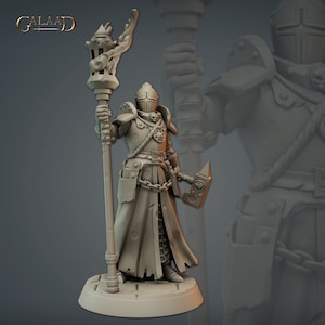 May include: A miniature figurine of a knight in full armor, holding a torch and a hammer. The knight is wearing a long, flowing robe and a helmet with a skull design. The figurine is made of a gray, unpainted plastic.