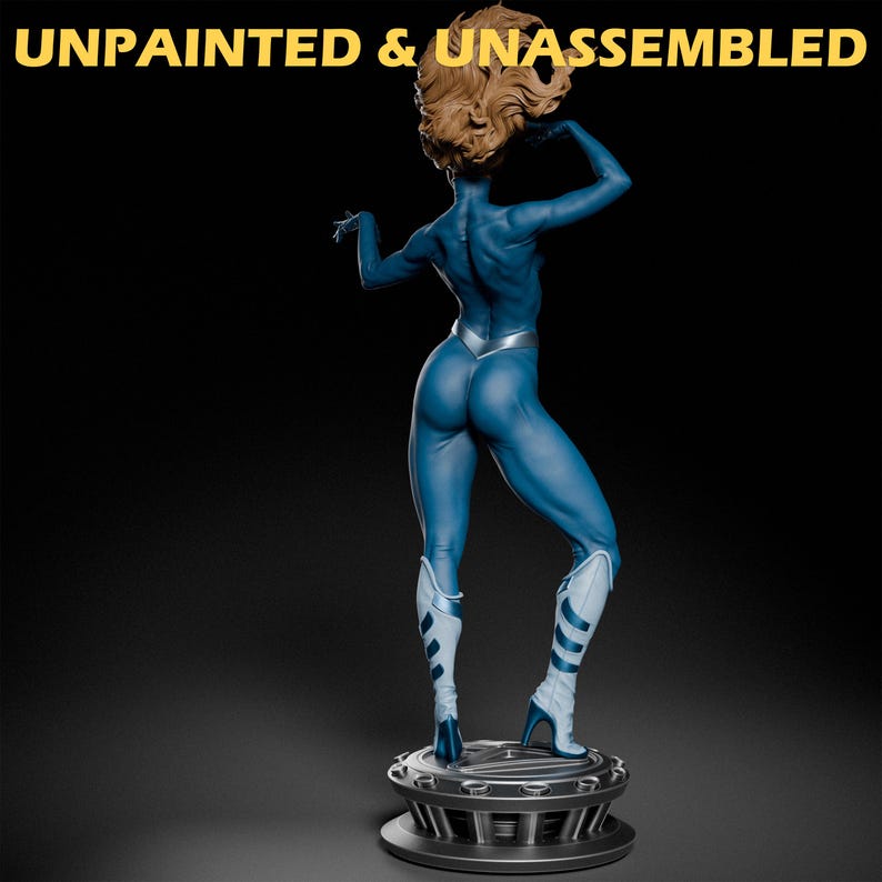 May include: Unpainted and unassembled blue figurine of a woman with blonde hair, wearing a silver and blue suit, standing on a black base.