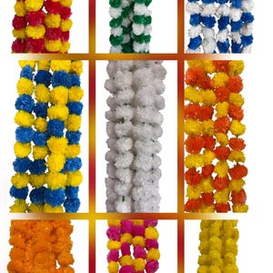May include: A collection of nine decorative garlands made of artificial marigold-style flowers in various color combinations, including red and yellow, green and white, blue and white, blue and yellow, solid white, orange and yellow, solid orange, pink and yellow, and solid yellow.
