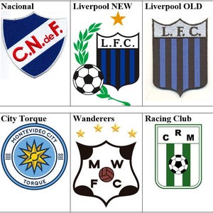 Può includere: Una griglia di nove loghi di squadre di calcio. I loghi sono di vari colori e stili, tra cui nero, bianco, rosso, blu, verde e giallo. I loghi sono tutti a forma di scudo, ad eccezione del logo del City Torque, che è un cerchio.