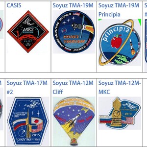 May include: A collection of nine embroidered patches featuring various space mission logos. The patches are circular, square, and diamond-shaped and feature a variety of colors, including blue, red, white, and black. The patches depict spacecraft, astronauts, and the Earth.