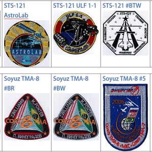 May include: A collection of nine embroidered patches, each representing a different space mission. The patches feature various designs, including spacecraft, stars, and flags. The patches are all rectangular or circular in shape and have a variety of colors, including red, white, blue, green, and yellow.