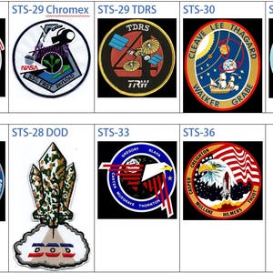 May include: A collection of eight space shuttle mission patches. The patches are circular and feature various designs, including an eagle, a satellite, and a spaceship. The patches are labeled with the mission number and name, such as STS-29 Chromex, STS-29 TDRS, and STS-30 Magellan.