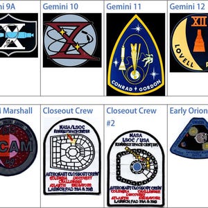 May include: Collection of space mission patches, including Gemini 9A, 10, 11, and 12, featuring various designs and text. Other patches include DCAM Marshall, Closeout Crew, and Early Orion, showcasing intricate details and colors.