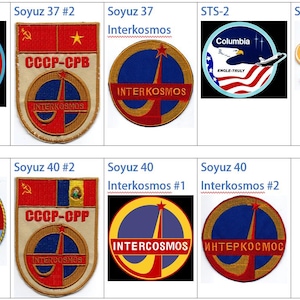 May include: A collection of eight embroidered patches, each representing a different space mission. The patches feature various designs, including flags, rockets, and spacecraft. The patches are all in different colors and sizes.