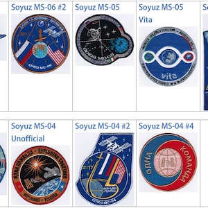 May include: A collection of nine embroidered patches, each representing a different Soyuz spacecraft mission. The patches feature various designs, including the Earth, stars, and the Soyuz spacecraft itself. The patches are all blue, white, and red.