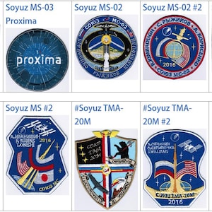 May include: A collection of eight embroidered patches featuring the Soyuz spacecraft. The patches are in various colors and designs, including blue, red, white, and black. Some patches feature the names of the astronauts who flew on the Soyuz missions, such as Takuya Onishi and Sergey Ryzhikov.