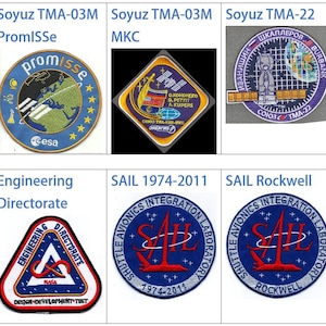 Op de afbeelding: Een verzameling van negen geborduurde patches met verschillende logo's van ruimtevaartmissies. De patches zijn rond, vierkant en driehoekig en hebben verschillende kleuren, waaronder blauw, rood, wit en groen. De patches bevatten tekst zoals "Soyuz TMA-03M", "PromISSe", "MKC", "STS-300", "Kennedy", "Engineering Directorate", "SAIL 1974-2011" en "SAIL Rockwell".