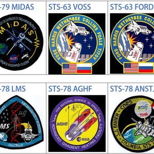 May include: A collection of nine NASA space shuttle mission patches. The patches are circular and feature various designs, including a handshake, a satellite, and a DNA strand. The patches are all in different colors and have the mission name and crew members' names printed on them.