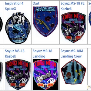 May include: A collage of nine embroidered patches featuring various space mission logos. The patches are circular, square, and shield-shaped and feature a variety of colours, including blue, red, white, black, and gold. The patches include the names "Inspiration4", "Soyuz MS-18", "Dart", and "Planetary Defenders".