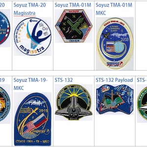 May include: A collage of nine embroidered patches, each representing a different space mission. The patches feature various designs, including spacecraft, astronauts, and flags. The patches are all circular or oval in shape and have a blue, white, and red colour scheme.