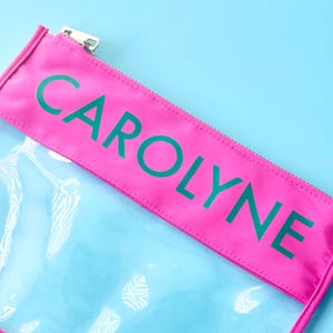 Personalized Mahjong travel pouch in hot pink with clear body and gold zipper, perfect for Mahjong tiles.