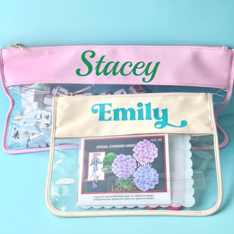 Custom Mahjong storage bag with name engraving, clear front, and zipper top, holding full Mahjong tile set.
