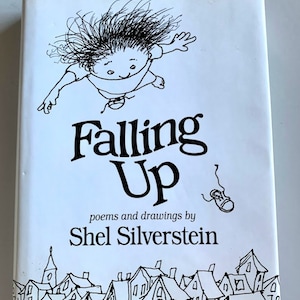 May include: A white book cover with a black and white illustration of a child falling with their arms outstretched. The title of the book is "Falling Up" and the author is "Shel Silverstein".