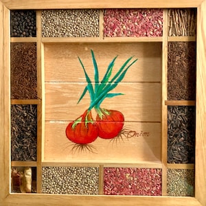 May include: A wooden spice rack with nine compartments, each filled with different spices. The center compartment features a painted image of two red onions with green stems and the word "Onion".
