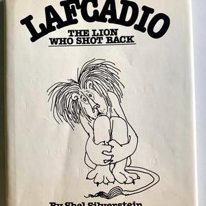 May include: A white book cover with black text that reads "LAFCADIO THE LION WHO SHOT BACK" by Shel Silverstein. A black and white illustration of a lion sitting on its haunches with its head down.