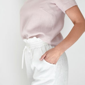 Women's drawstring linen shorts with high elastic waist and pockets for summer in white color