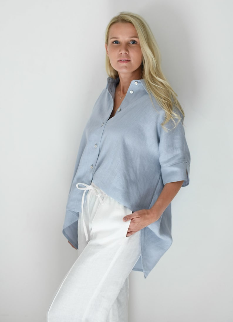 Oversized loose linen button up shirt for women in light blue color with long back and half sleeves