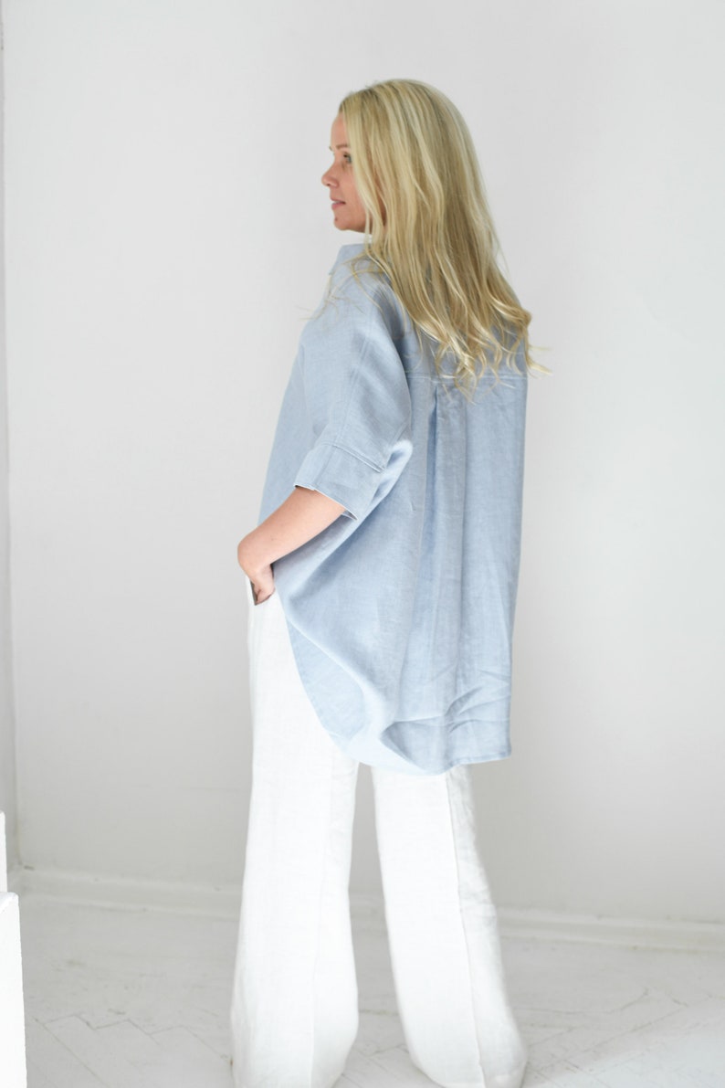 Oversized loose linen button up shirt for women in light blue color with long back and half sleeves