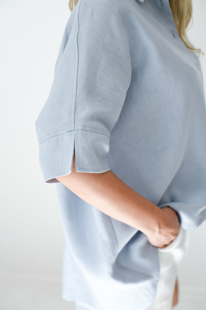 Oversized loose linen button up shirt for women in light blue color with long back and half sleeves