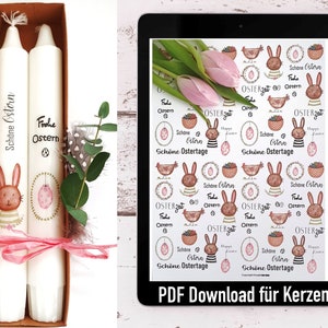 May include: Two white candles with a bunny and egg design. The candles are in a box and have the text "Schöne Ostern" and "Frohe Ostern" on them. The image also shows a tablet with a digital download for candle labels with Easter-themed designs.
