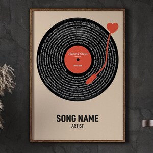 May include: A printable digital download of a song lyric art print. The print features a black and white record with a red heart and the lyrics of a song written in a spiral around the record. The text "SONG NAME" and "ARTIST" are printed below the record.