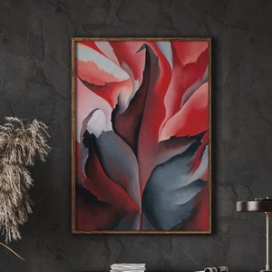 May include: Abstract painting of a red and blue flower with a dark background. The painting is framed in a wooden frame.
