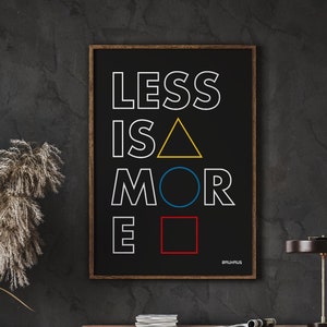 May include: A black and white printable wall art print with the text "LESS IS MORE" in a bold, white font. The text is surrounded by geometric shapes in yellow, blue, and red.