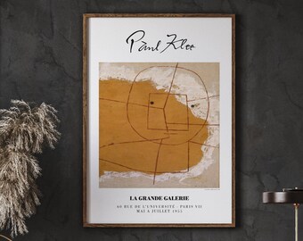 May include: A framed poster featuring an abstract painting by Paul Klee. The painting is in shades of yellow, brown, and white, with a black circle in the center. The poster includes the title "LA GRANDE GALERIE" and the dates "MAI A JUILLET 1955".