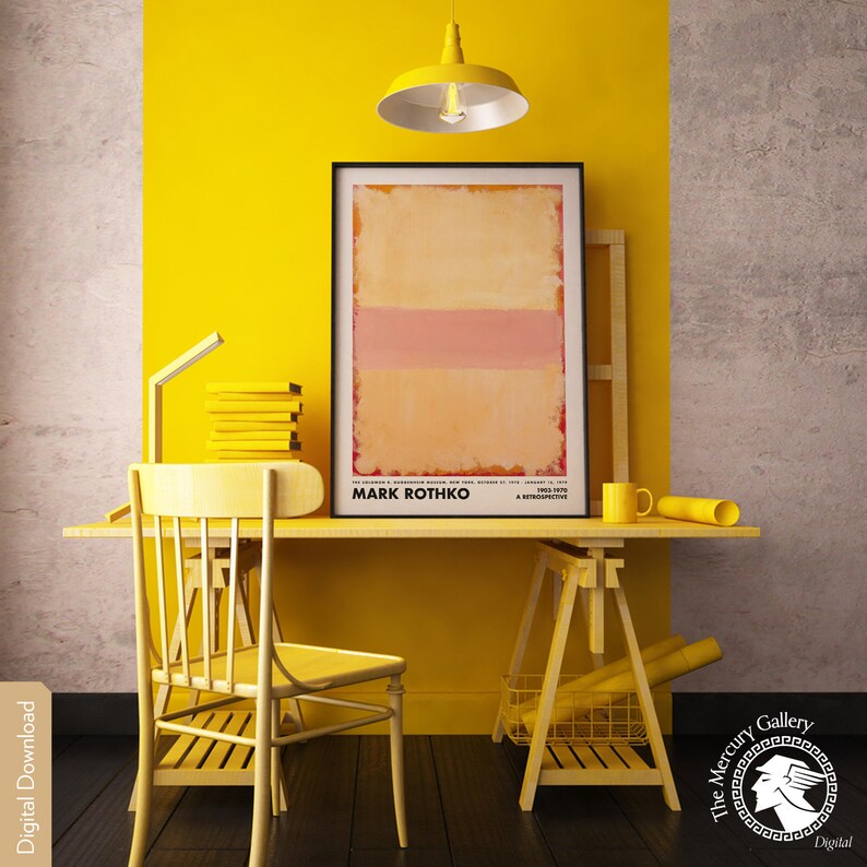 May include: A yellow desk with a yellow chair, a yellow easel, and a framed abstract painting by Mark Rothko. The painting is a light orange with a pink horizontal stripe. The text "Mark Rothko" is printed below the painting.