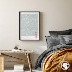 May include: A framed print of a blue and white wave pattern with the text "HOKUSAI" and Japanese characters in red. The print is hanging on a white wall above a wooden bench.