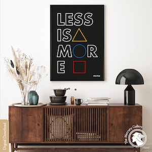 May include: A black and white poster with the text "LESS IS MORE" in white letters. The letters are stylized with geometric shapes in yellow, blue, and red.