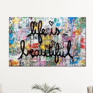 Lienzo decorativo "La vida es bella", póster callejero colorido estilo grafiti con letras negras que gotean, mensaje urbano audaz para interiores modernos.