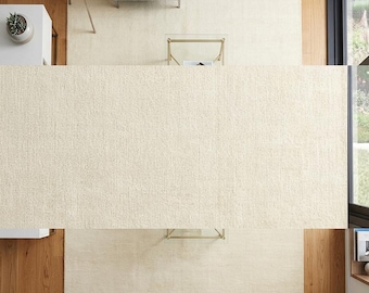 Handgeknoopt wollen vloerkleed, ivoorkleurig crème, minimalistische franjes, neutrale boho-stijl voor thuis