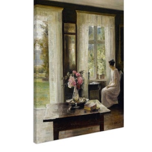 May include: A painting depicting a woman seated in a chair by a window in a room with white curtains. The woman is wearing a white dress and gazing out of the window. A vase of flowers sits on a table in the foreground.