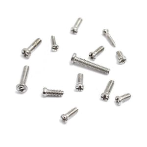 May include: A collection of silver-toned screws of various sizes, scattered on a white background.