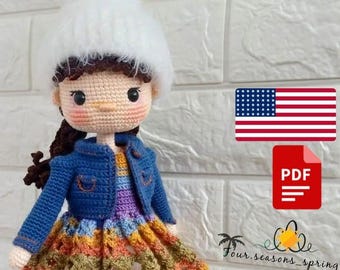 May include: Crochet doll wearing a white hat, blue denim jacket, and a colourful dress. The doll has brown hair and a sweet expression. The image includes the text "PDF" and a US flag.