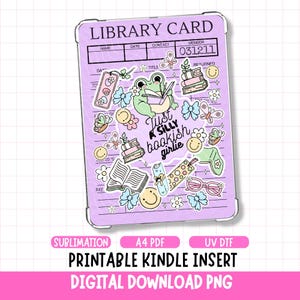 May include: A lilac-colored Kindle insert with a library card design. It features whimsical illustrations of a frog, books, butterflies, and flowers. Text includes "Just a silly bookish girlie" and "Printable Kindle Insert Digital Download PNG".