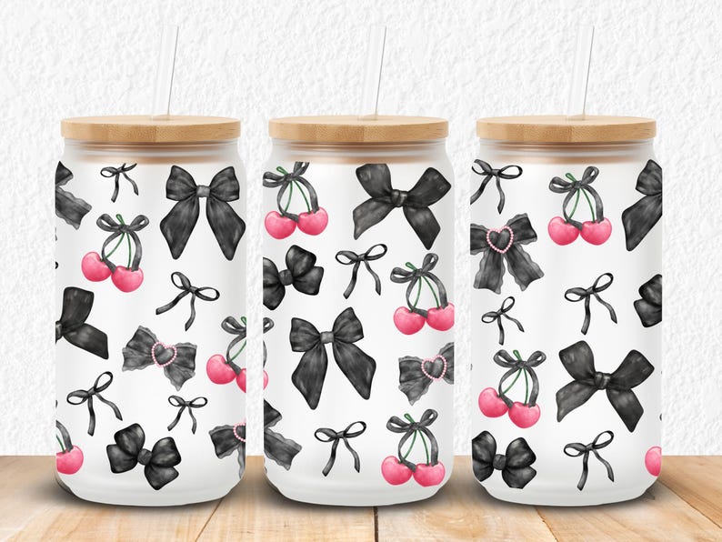 Stylish 16oz and 20oz Libbey glass can wrap featuring a chic coquette aesthetic with glossy black bows, pearl heart accents, and vibrant pink cherries on a sleek black background. Perfect for sublimation or UV DTF transfers, this seamless design adds a cute yet edgy vibe to drinkware, making it ideal for gifts, small business products, or custom tumblers. Sized to fit both 16oz and 20oz Libbey glass cans for a flawless wrap finish.